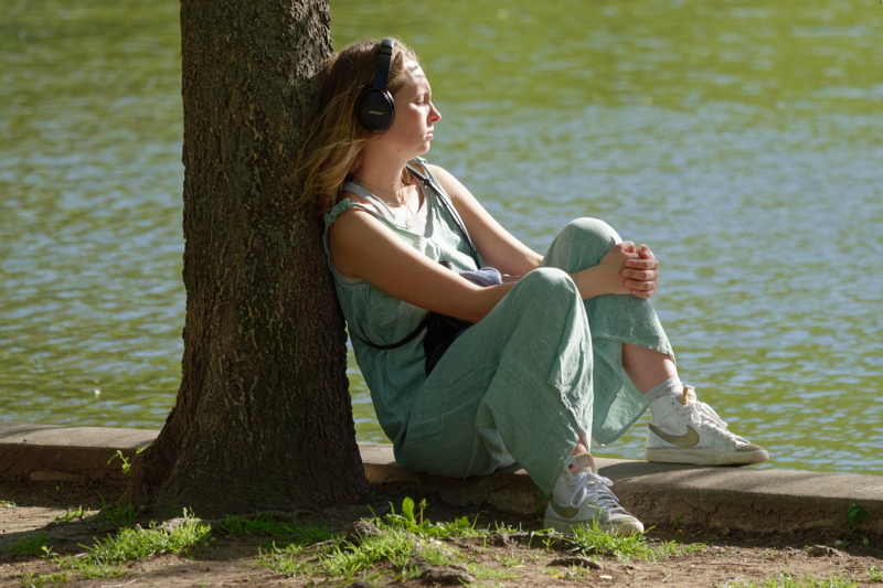 Girl relaxing on lake border
